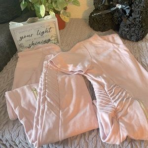 A pair of small Jaanuu light pink colored scrubs.👚